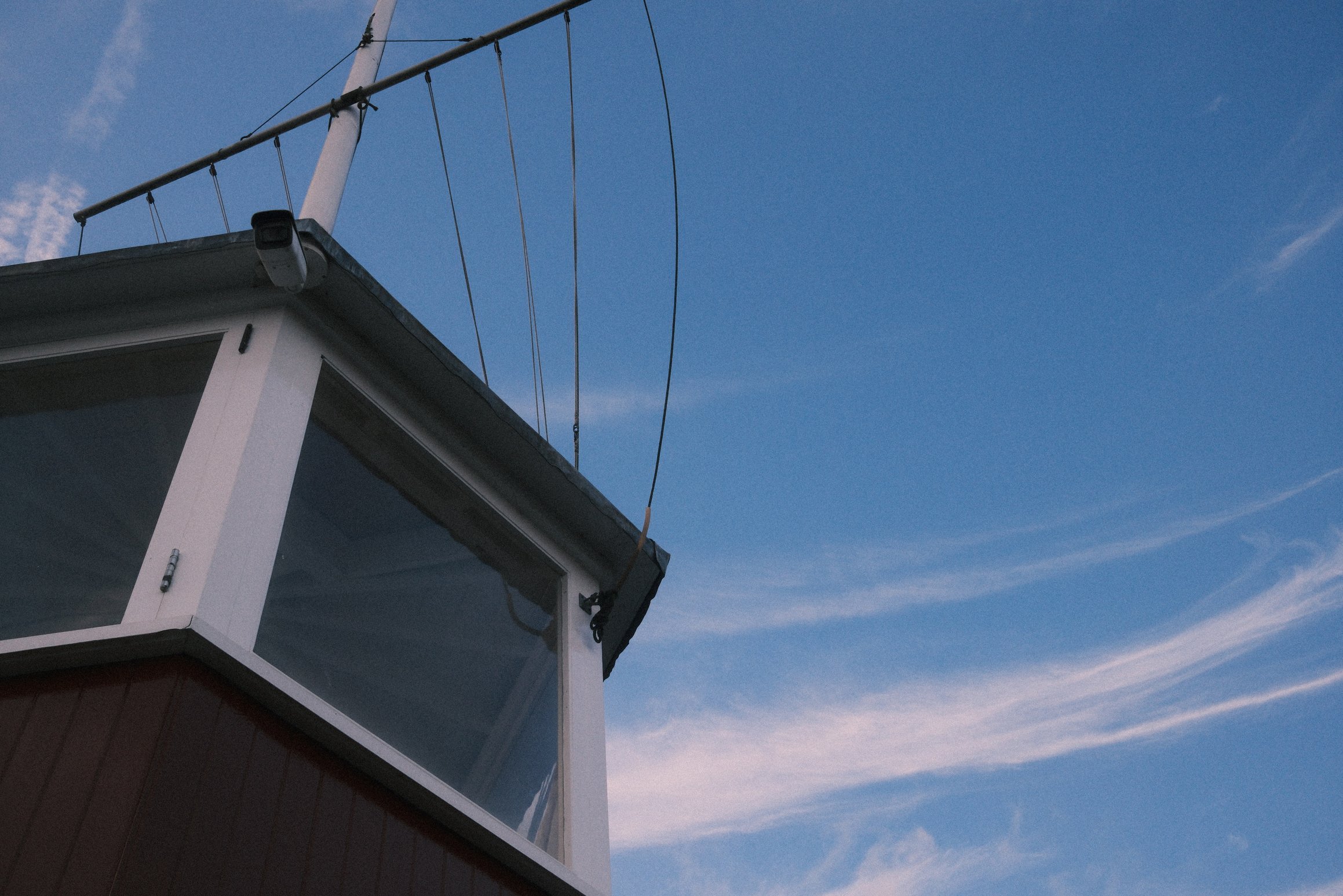 looking up at the sky, in the foreground the windows of a lookout tower