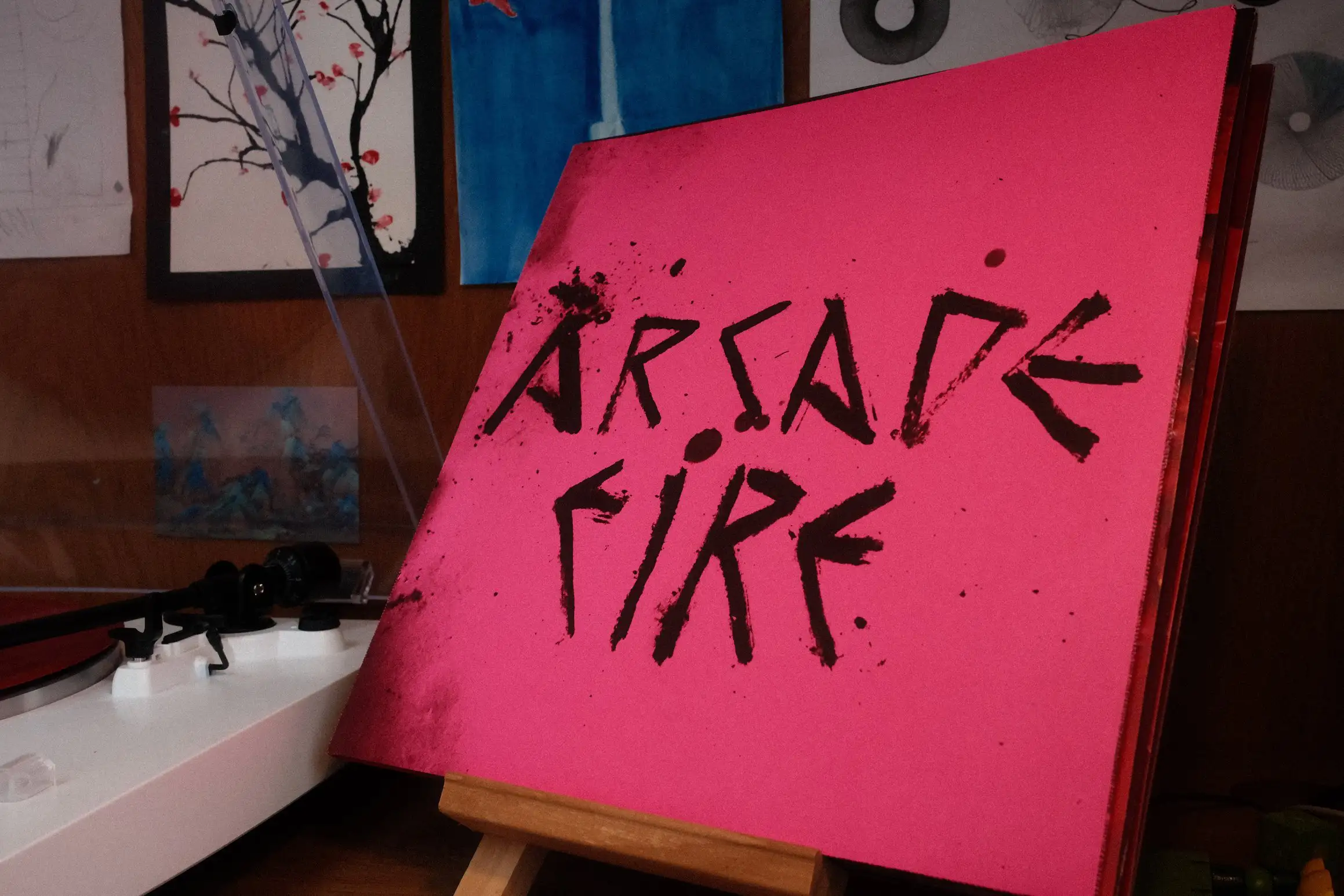 A photo of an album cover; Pink Elephant by Arcade Fire
