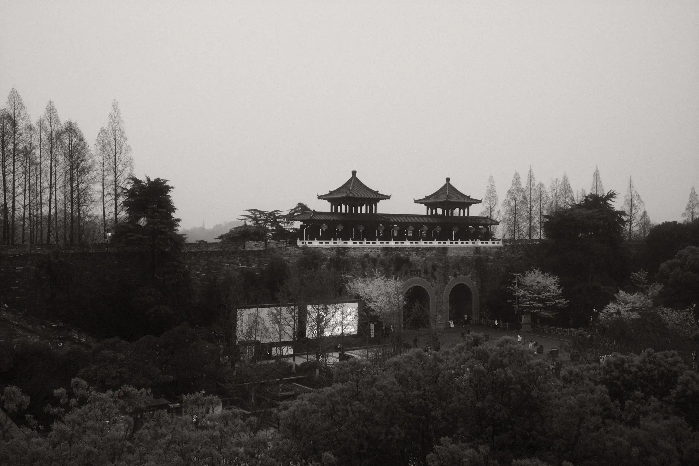 a black and white photo of Xuanwu Men, the gate to the Xuanwu lake