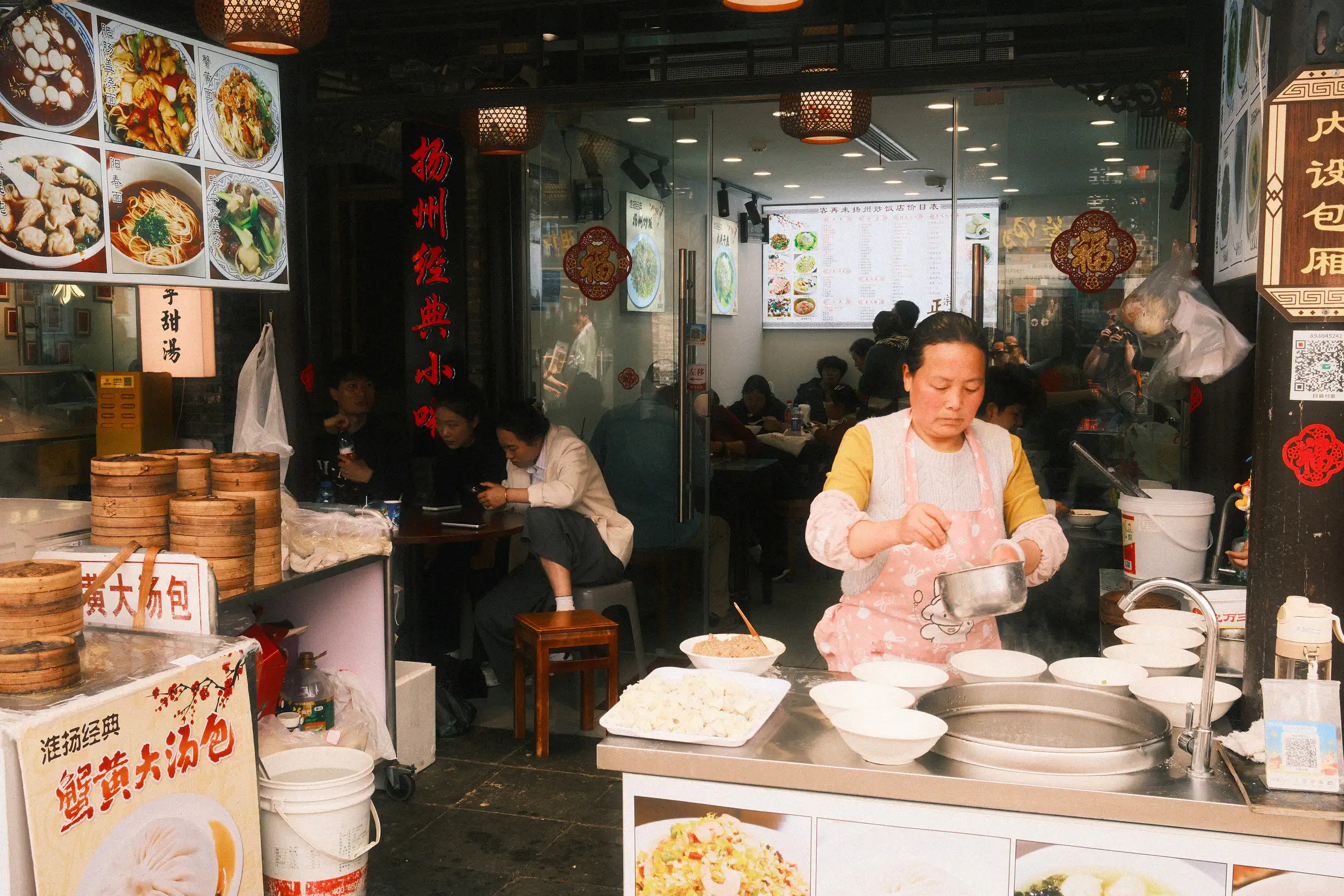a small local restaurant, food being prepared out front rather than out back