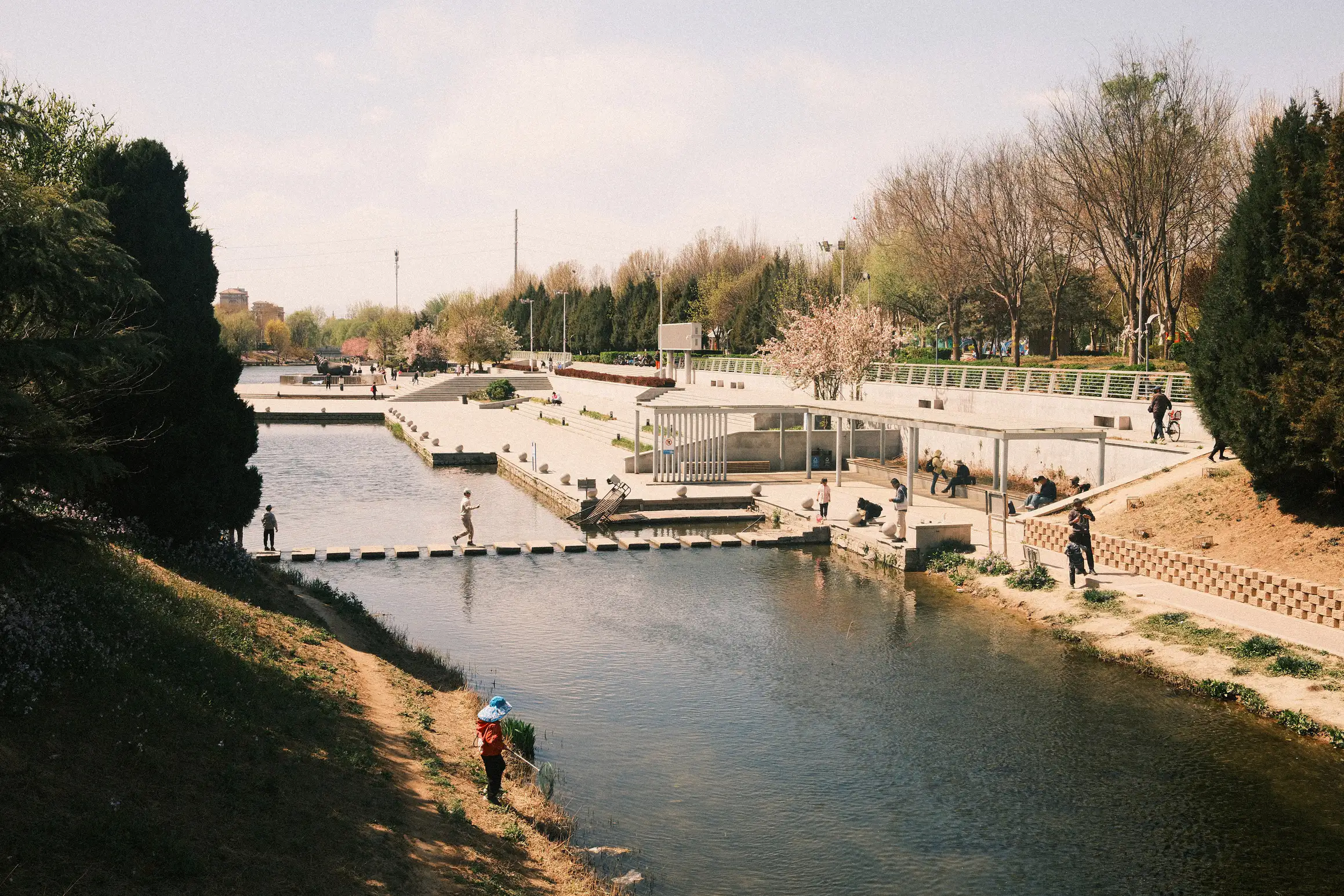 people fishing in a small river