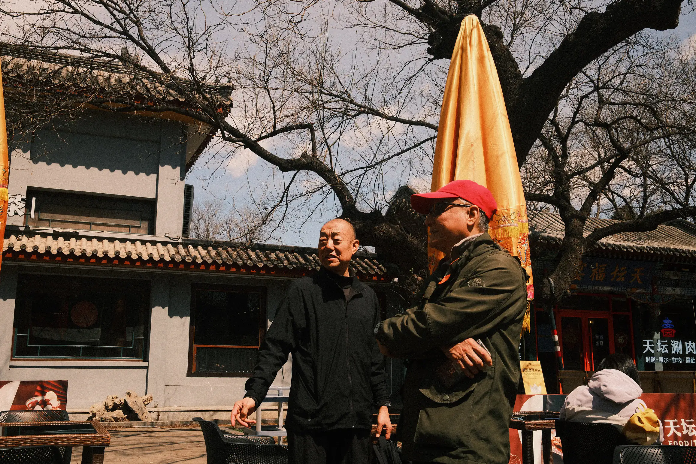 two men in discussion in the temple of heaven