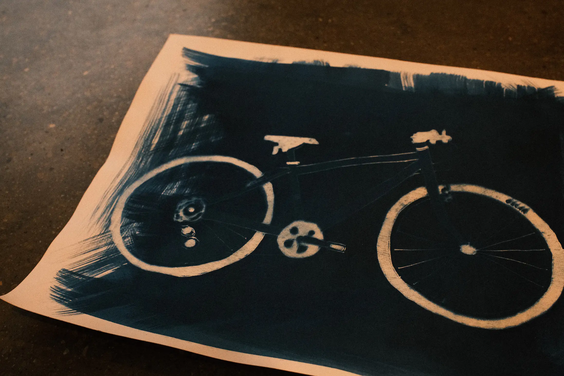A drawing of a bicycle printed in cyanotype blue