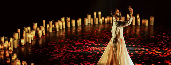 An photo of Aakash Odedra performing on stage in Songs of the Bulbul