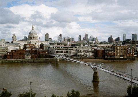 A view of the London skyline looking over the Milenium Bridge and St Pauls Cathedral.